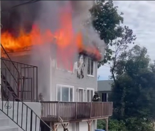 An image of Rahkim Sabree's home, engulfed in flames