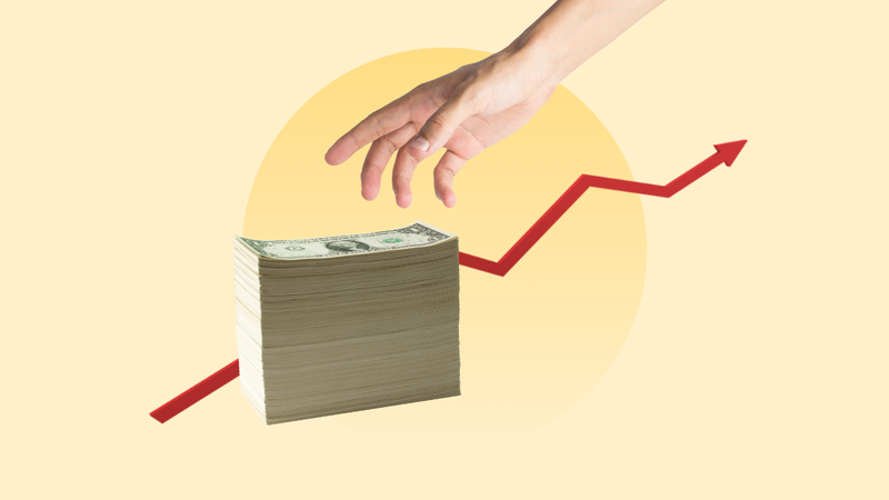 U.S. dollars against a background of a rising rate arrow